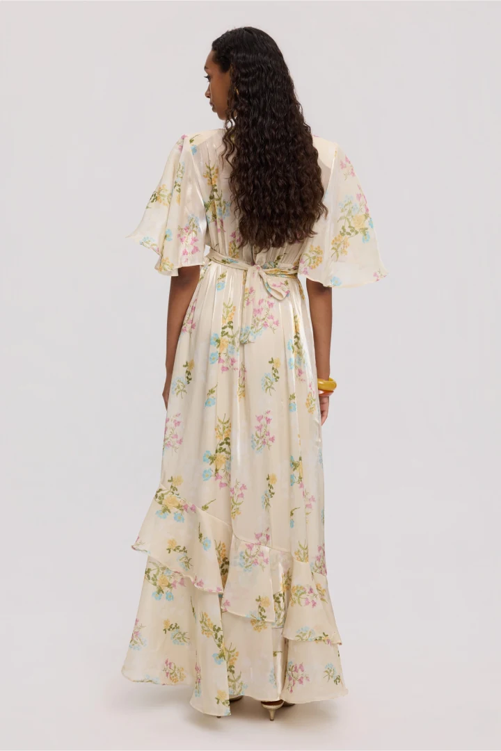 Πίσω όψη του Ciel Concept Butter Blossom Long Dress που αποκαλύπτει τη ρευστή κίνηση της φούστας και τη λεπτομέρεια με το δέσιμο στη μέση